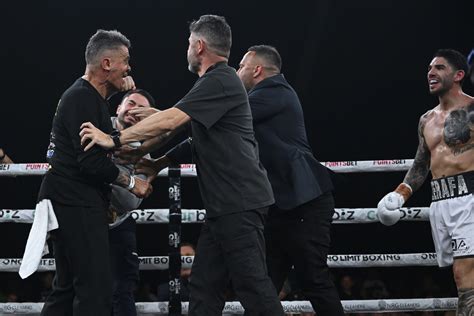 define melee|Boxer’s brother punches rival’s trainer in chaotic post .